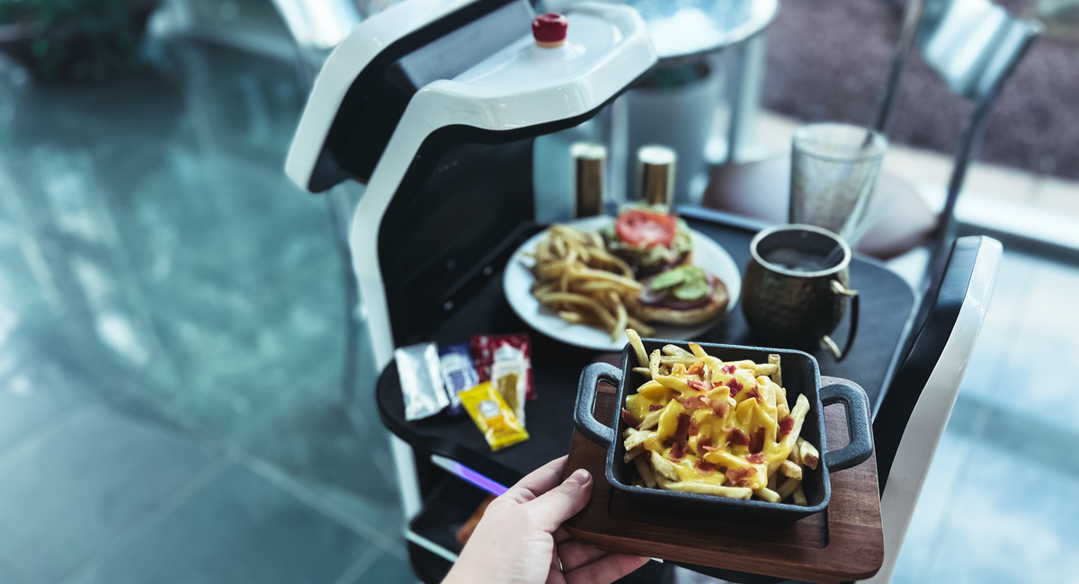Placing an order with a restaurant's waiter robot.